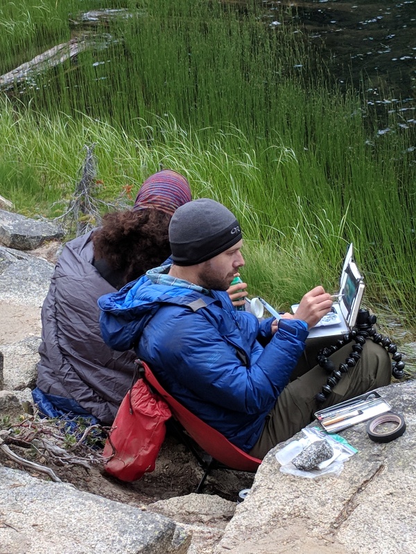 Trevor Taylor using a prototype backpacking sketch easel